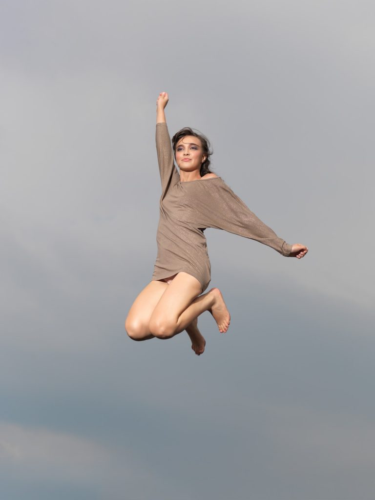 happy, young woman jumping